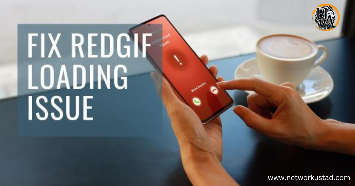 A person’s hand holding a smartphone with an on-screen message “FIX REDGIF LOADING ISSUE” against a blurred background featuring a laptop and a cup of coffee.